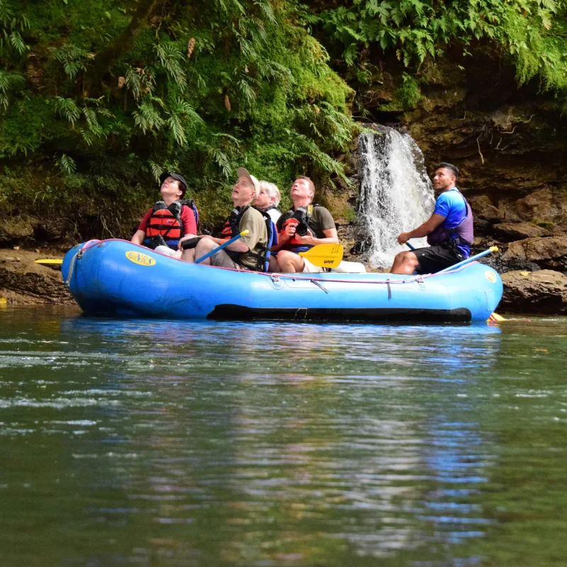 Group enjoying rafting tour near a hidden waterfall with Wave Costa Rica