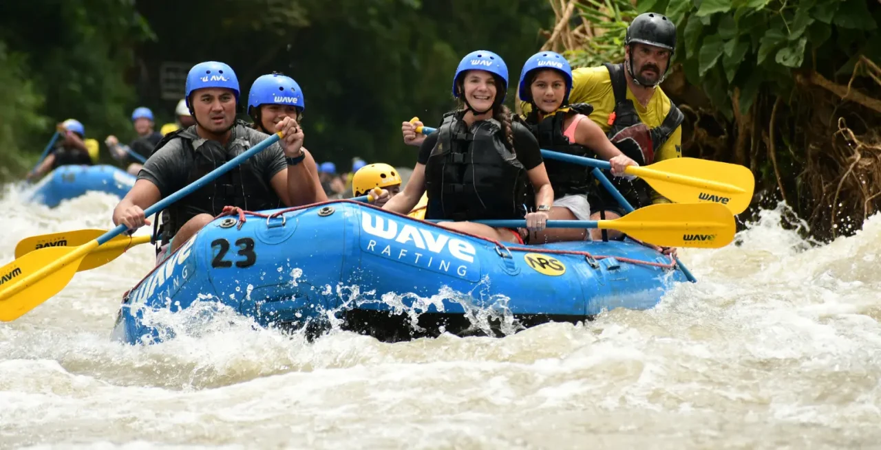 Group navigating calm whitewater rapids with Wave Rafting